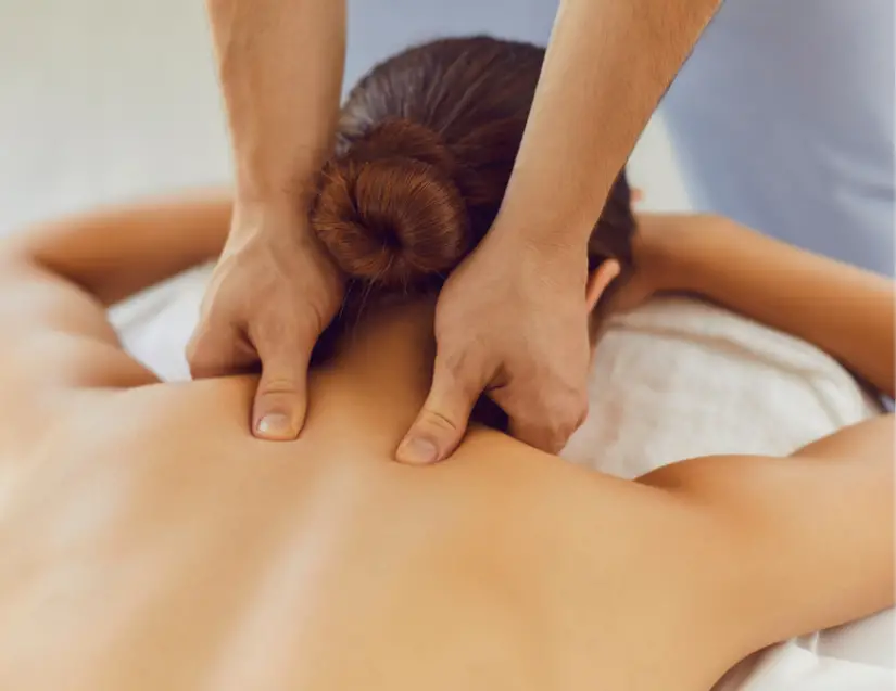 Tight Neck Muscles Relief tip #4. Get a massage, woman getting neck massage lying prone