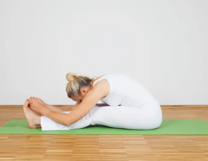 woman stretching to demonstrate specificity principle for fitness success in 2025