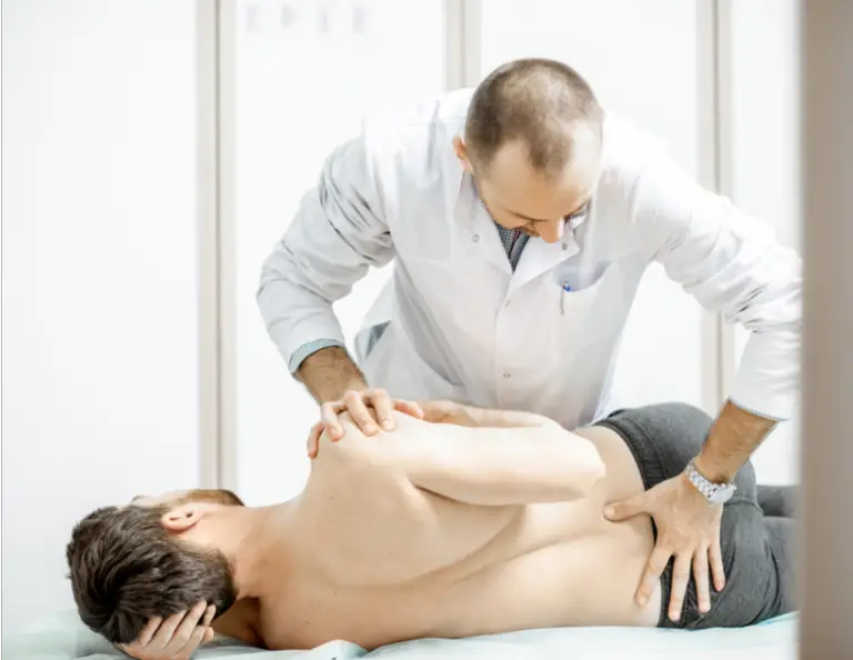 image of how spinal manipulation works performed by clinician for lumbar spine rotational manipulation